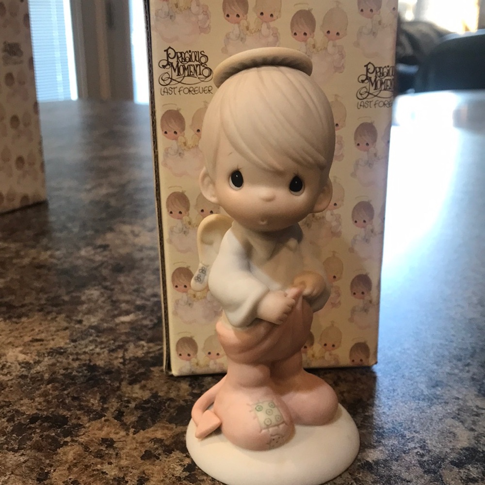 Precious moments figure, porcelain. “Part of me wants to be good”.